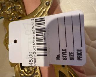 Ornate gold mirrored wall sconce