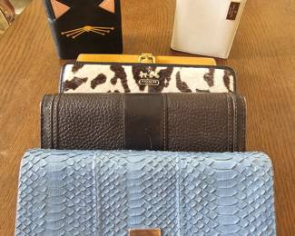 Assortment of wallets Michael Kors,  Kate Spade,  Coach