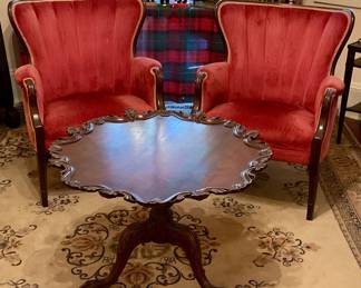 Red velvet arm chairs, pie crust table