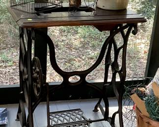 sewing machine base, crock jug, bird cage top