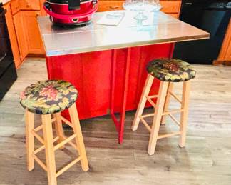 Rolling kitchen island with stainless drop-leaf top (detail)...