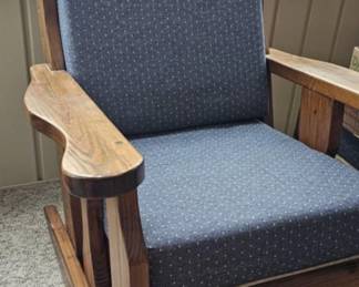 Rocking chair has matching ottoman and sofa