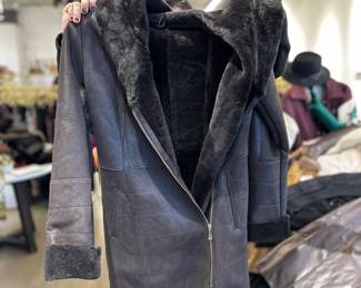Black leather and fur, with zipper closure