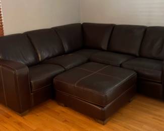 BROWN LEATHER SOFA AND OTTOMON