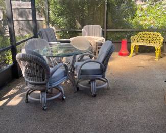 Glass top round patio table w/4 chairs on casters, metal love seat