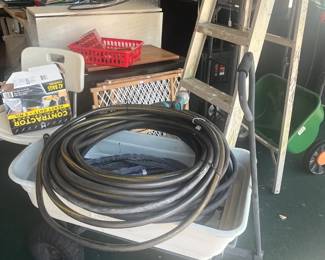 Plastic wheel barrow, garden hose, pet gates, shower chair