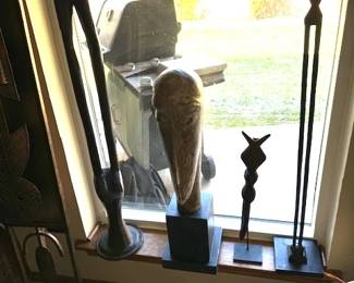 Sculpture in the stule of the FANG tribal mask. Yoruba tribe ceremonial staff, Nyamwezi stick figure