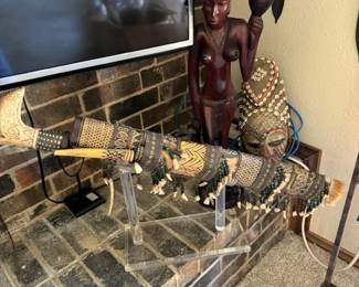 Mandau stule Indonesian  Borneo dagger with scabbard,  Chokwe tribe pwo-style mask with female face,  carved statue