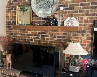 Decorative items on mantle and wall