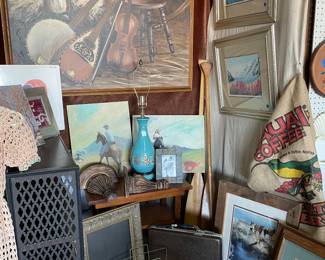 Large framed painting, Kauai Coffee bag, painting of horses, vintage light teal lamp, ornate frames, wood paddles, 