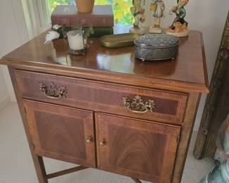 Nightstand. Hummel figurines. 