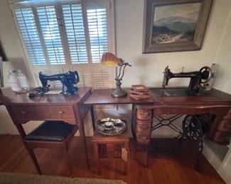 An early electric seeing machine and a 1900 turn-of-the-century treadle sewing machine