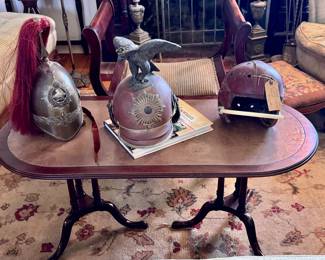 19th Century military helmets and a 1920s leather football helmet