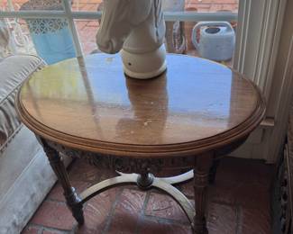 Antique mahogany side table with curved stretcher bar