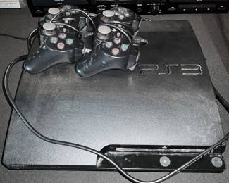 PS3 and Two Game Controllers 