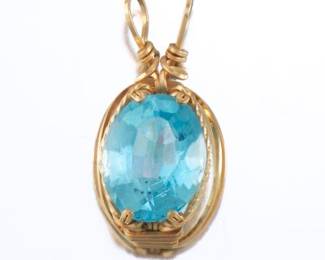 Lades Topaz and Gold Pendant
