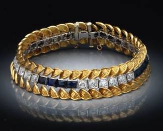 Edwardian Platinum, Gold, Lab Grown Blue Sapphire and Diamond Line Bracelet with Later Foliate Decorated Frame