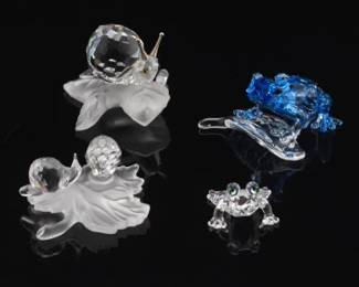 A group of Swarovski Crystal Frogs and Snails