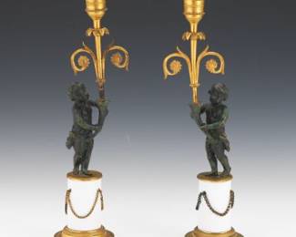Pair of French DOre and Patinated Bronze Putti Candleholders