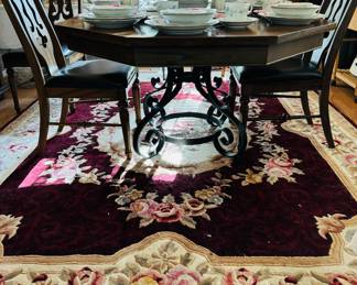 Octagonal dining room table with metal Decorative base