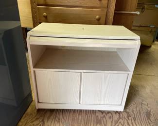 Lot 334 | Wood TV Stand on Wheels
