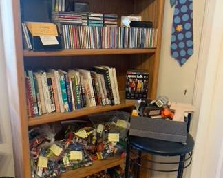 Assorted CDs, Books, and Action Figures