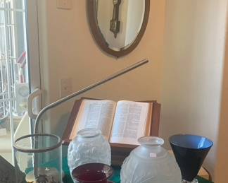 Vintage Oval Beveled Mirror, Antique Sold Wood Swivel Bible/Book Stand, Assorted Vases, Tommy Bahama Style Glass and Metal Palm Tree Candle Holder, Museum of Glass Ruby Vase