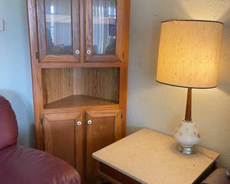 Corner curio cabinet, vintage lamp, and end table