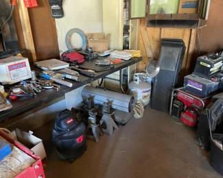 Lots of garage items, tools, generator, car, ramps, salamander heater, small Shop vac