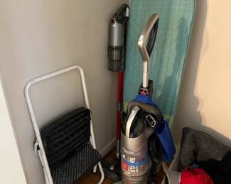 hats, vacuum, step stool, ironing board