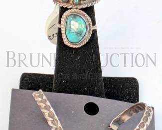 NAVAJO STERLING RINGS AND EARRINGS (1) PAIR OF STERLING SILVER HOOP EARRINGS WITH TOOLED METAL DESIGN. 1" (1) STERLING AND...