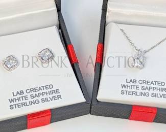 SAPPHIRE AND STERLING EARRINGS & NECKLACE (1) PAIR OF WHITE SAPPHIRE AND STERLING SILVER STUD EARRINGS IN A HALO SETTI...