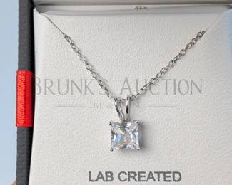 SAPPHIRE AND STERLING EARRINGS & NECKLACE (1) PAIR OF WHITE SAPPHIRE AND STERLING SILVER STUD EARRINGS IN A HALO SETTI...