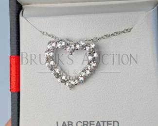 SAPPHIRE AND STERLING EARRINGS & HEART NECKLACE (1) WHITE SAPPHIRE AND STERLING SILVER HEART PENDANT NECKLACE. 18"...