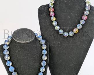 (2) LARGE AURORA BOREALIS NECKLACES (2) LARGE BEADED NECKLACES MADE OF AURORA BOREALIS GLASS BEADS. 1 HAS A BL...