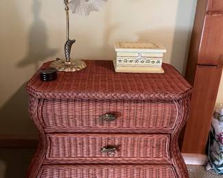 Three-drawer wicker chest.