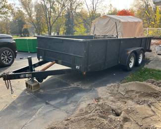 Trailer with bed measuring approximately 18’ x 6-1/2’.