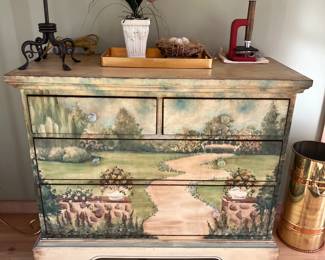 Painted four-drawer chest with garden motif.