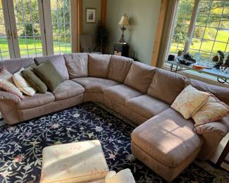 Sectional sofa with suede or suede-like upholstery.