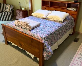 Full bed with pine headboard and footboard. Includes mattress and box spring.