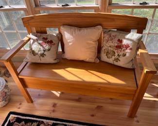 Oak bench with storage below seat.