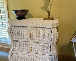 Three-drawer wicker chest.