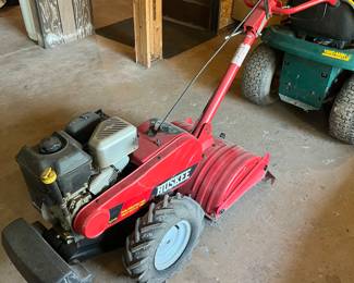 Huskie 6.5 HP tiller w/dual direction tines and 16” tires.