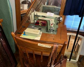 Vintage NEW HOME sewing machine with cabinet