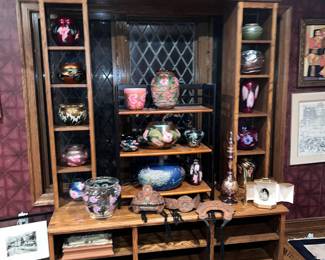 Lots of art glass on the shelf unit for sale also