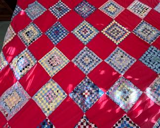 Hand pieced postage stamp quilt topper