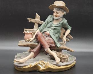 Collectible Ceramic Figurine of Old Hobo on Bench