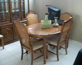 Broyhill table, 6 chairs, 1 leaf and pads, and china cabinet