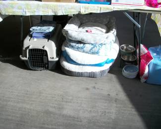 dog carrier, pet beds, food dishes, toys, leashes