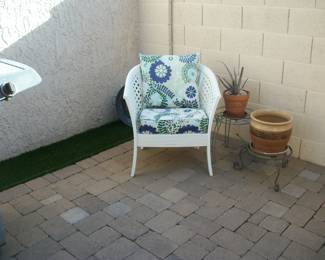 chair, plant stands and pots